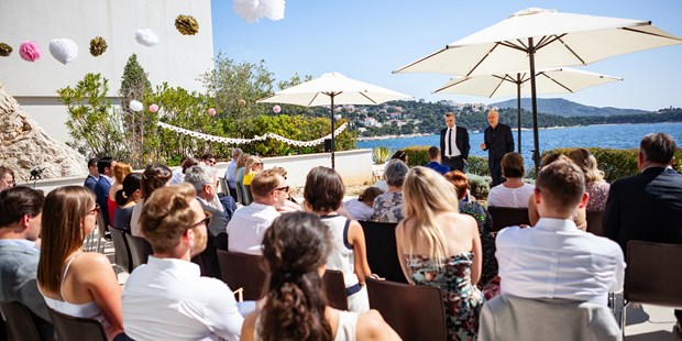 Hochzeitsfotos - Fotobox mit Zubehör - Soest - trauung am meer - Slawa Smagin - lockere Hochzeitsreportagen in AT,CH,DE